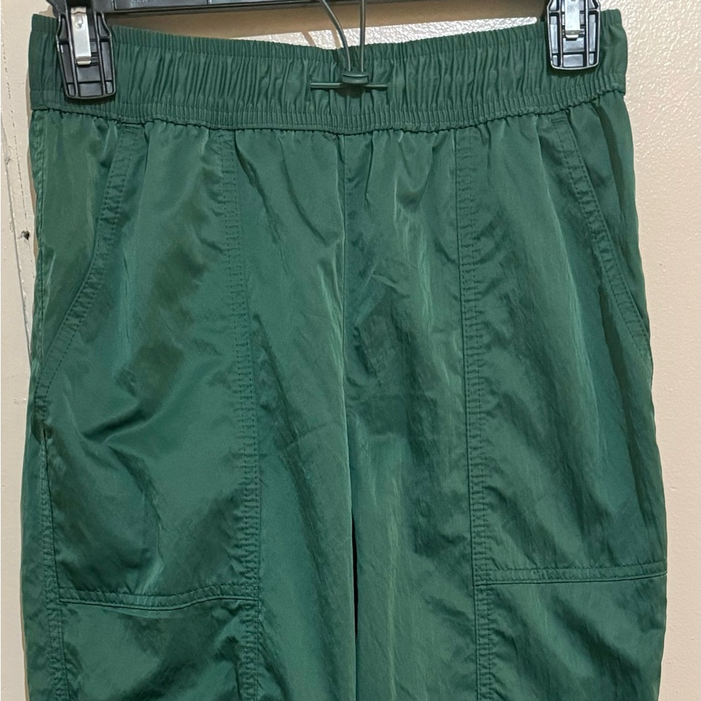 Hunter green wind breaker/jogger pants.
